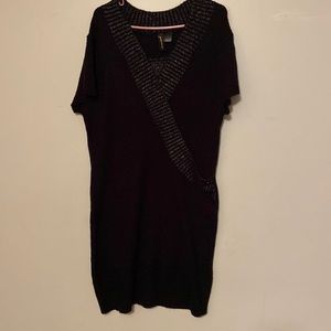 Extra touch sweater dress is black with gold prints.